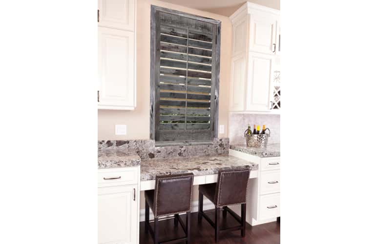 Reclaimed wood shutters on kitchen window in Bluff City